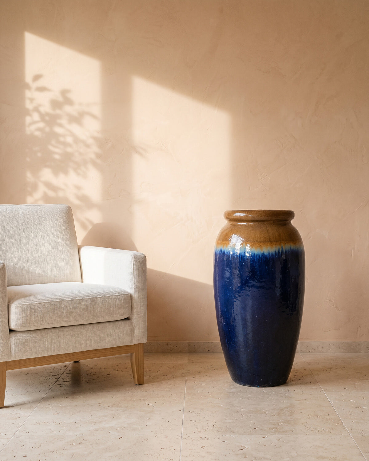 Azure Glow Jar, shown beside a linen armchair for scale