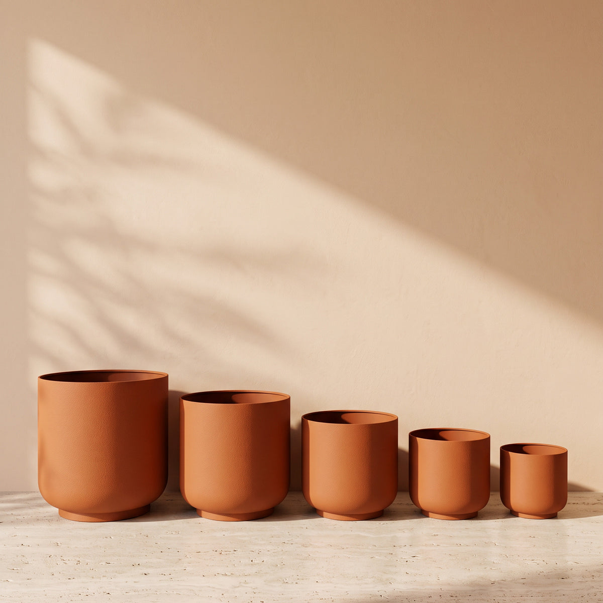 Classic Leather Texture Metal Pot in Terracotta, all sizes shown together