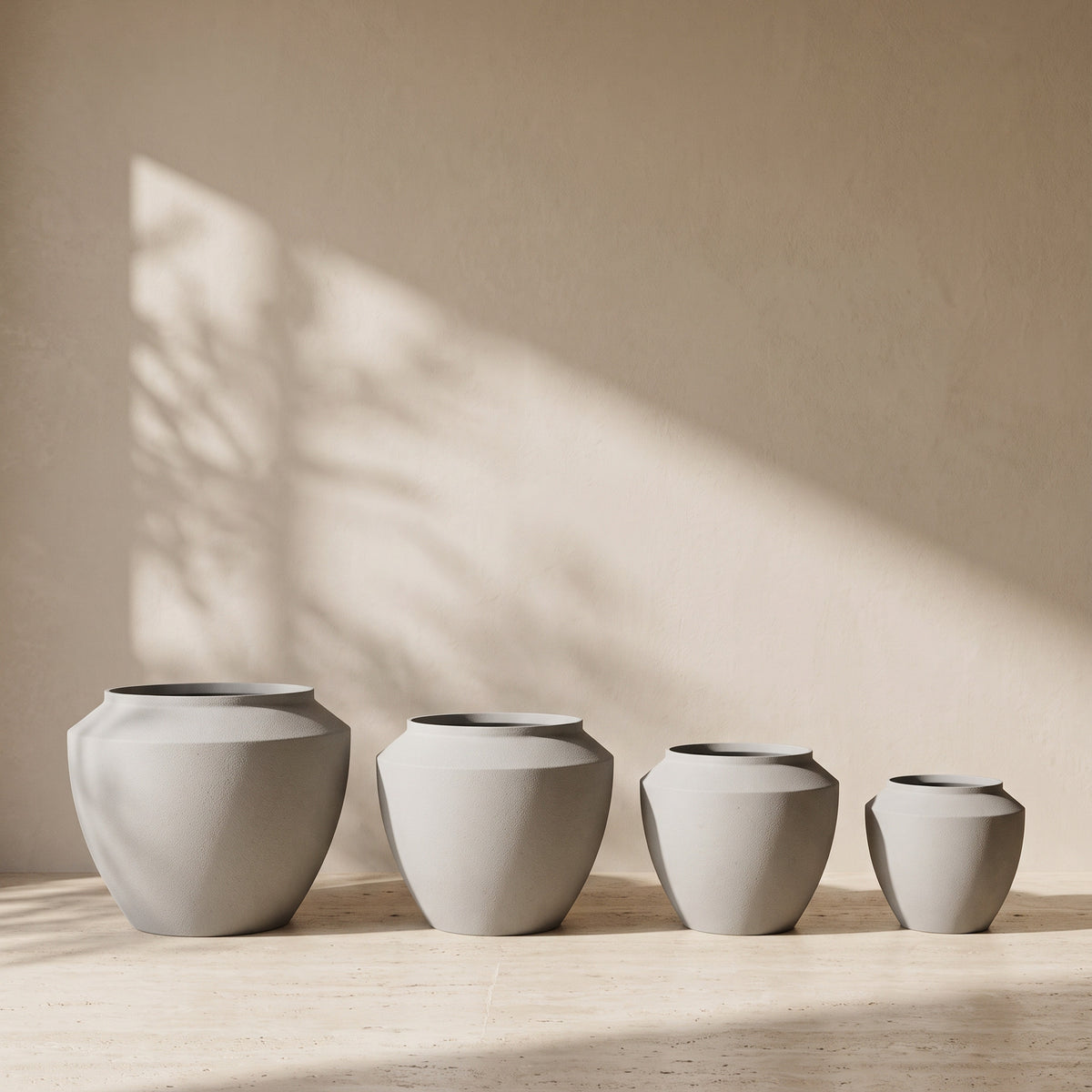Urban Aura Stone Texture Metal Pot in Concrete, all sizes shown together