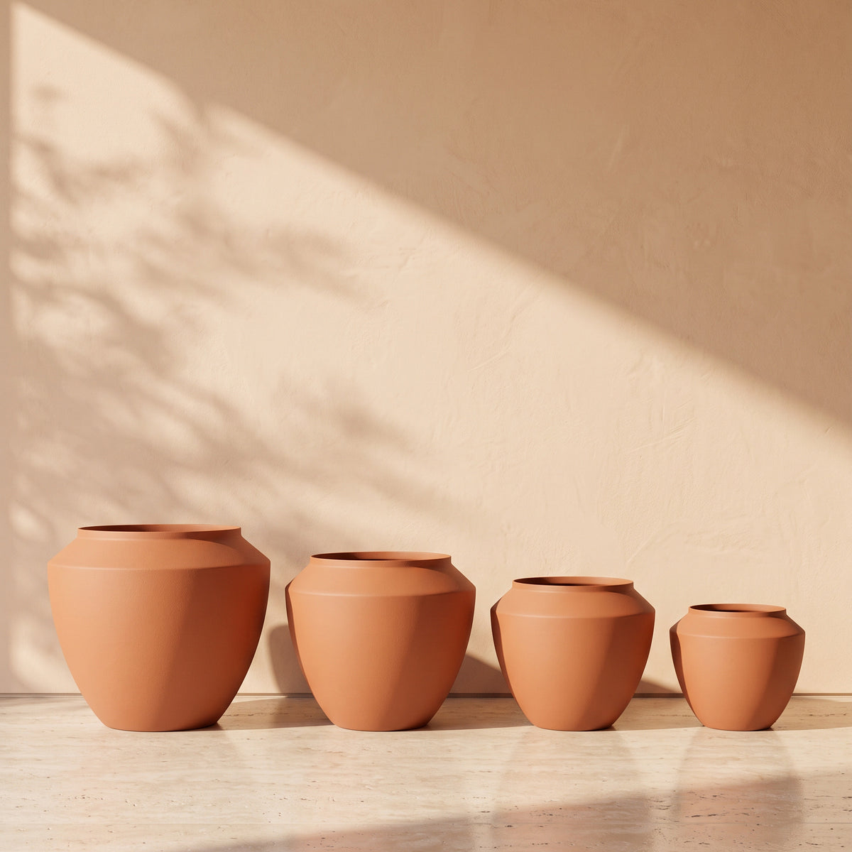Urban Aura Stone Texture Metal Pot in Terracotta, all sizes shown together