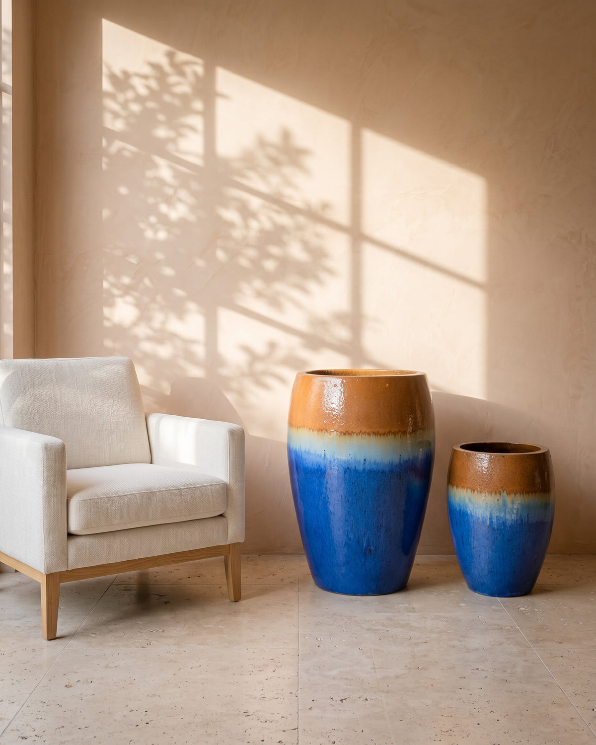 Ombre Glazed Jar, all sizes, shown beside a linen armchair for scale