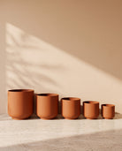 Classic Leather Texture Metal Pot in Terracotta, all sizes shown together