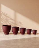 Leather Pedestal Metal Pot in Maroon, all sizes shown together