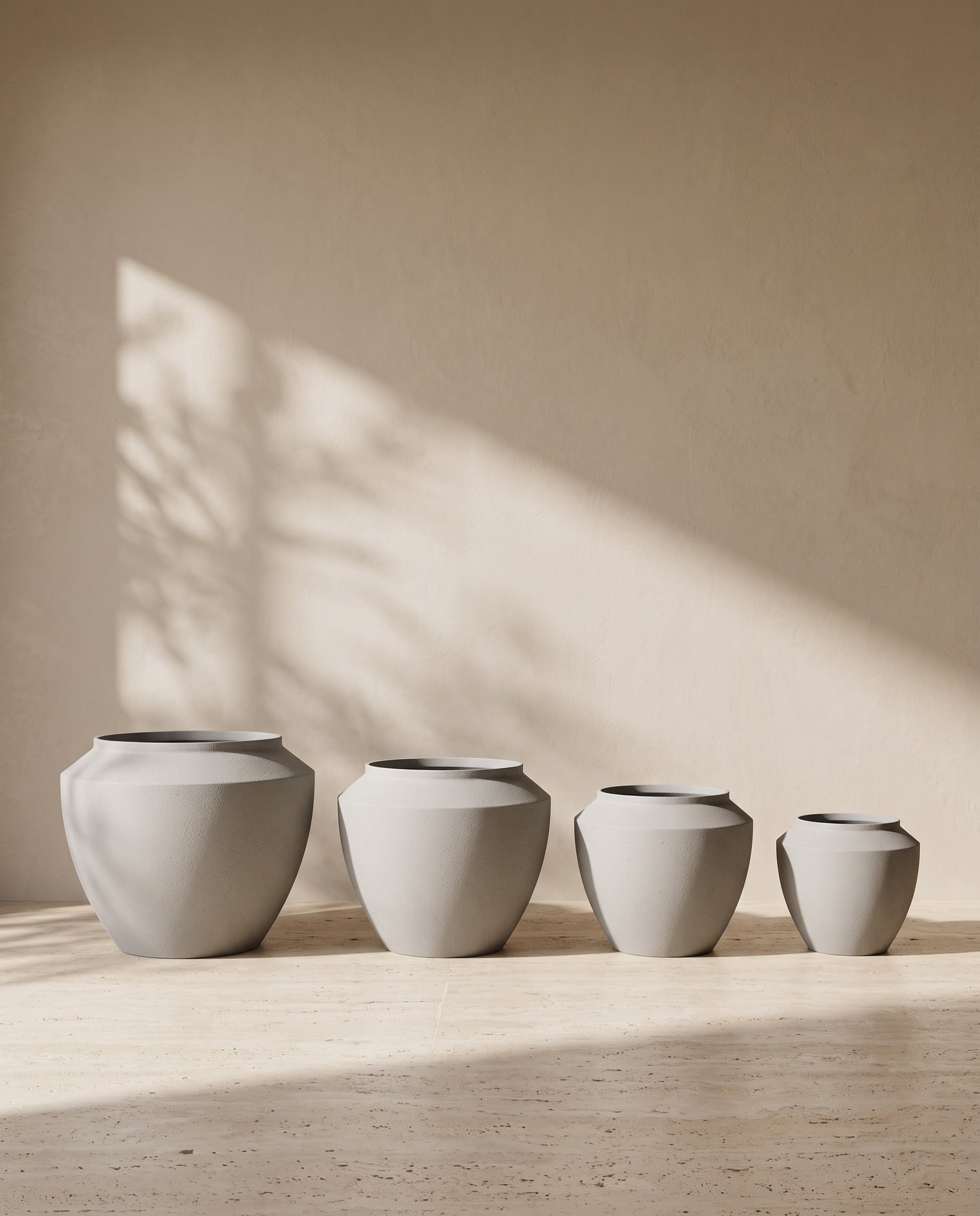 Urban Aura Stone Texture Metal Pot in Concrete, all sizes shown together