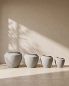 Urban Aura Stone Texture Metal Pot in Concrete, all sizes shown together