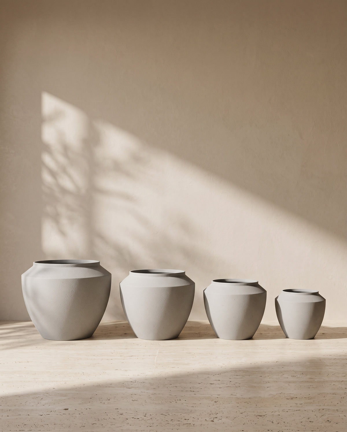Urban Aura Stone Texture Metal Pot in Concrete, all sizes shown together