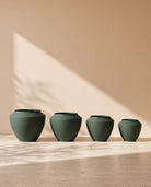 Urban Aura Stone Texture Metal Pot in Dark Green, all sizes shown together