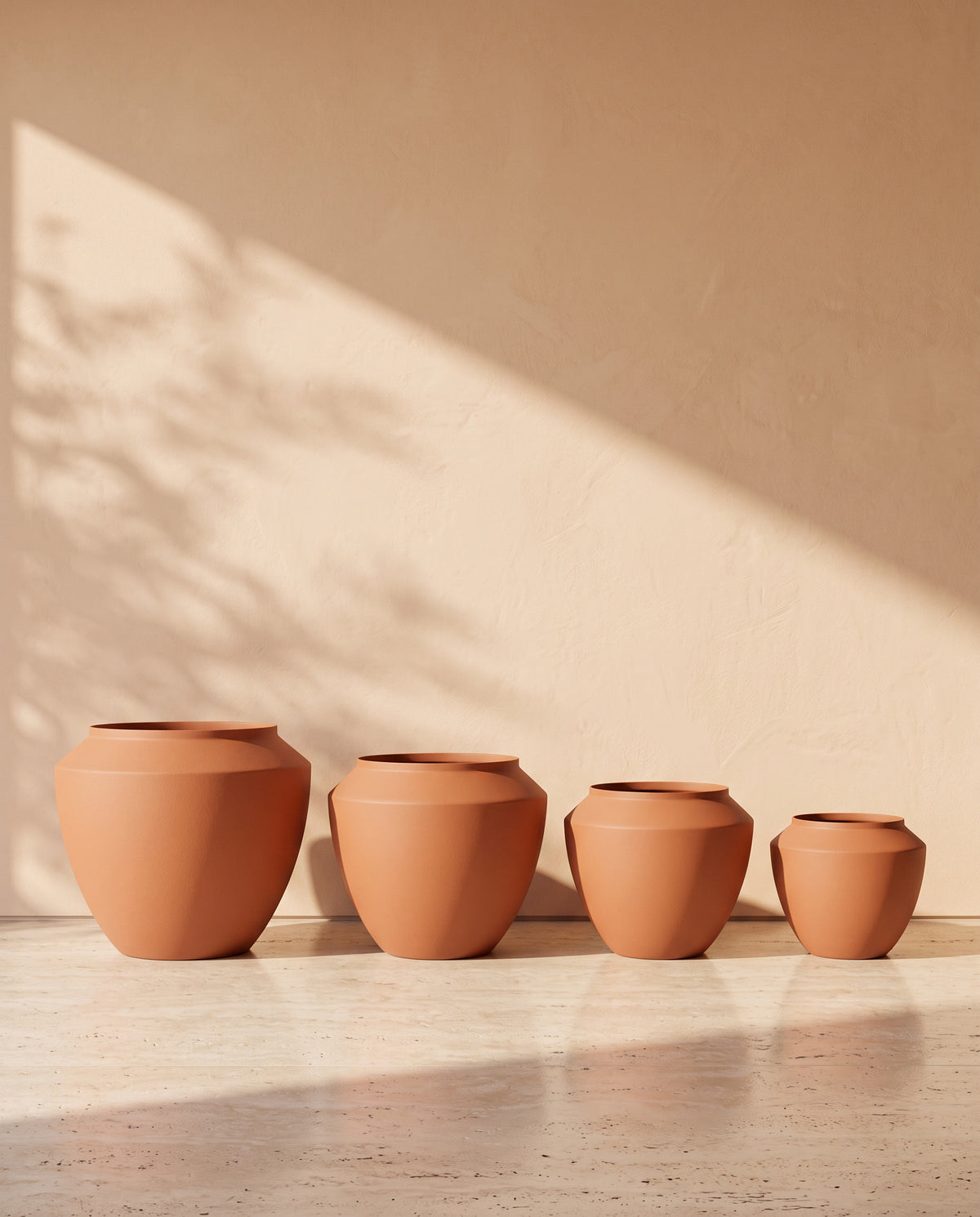 Urban Aura Stone Texture Metal Pot in Terracotta, all sizes shown together