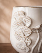 White Glossy Floral Pot, close-up of the surface texture
